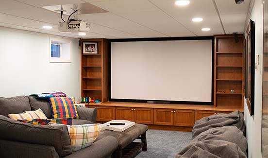 Home theater with projection screen and couch