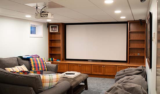 home theater in the basement with built in cabinets