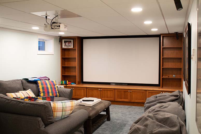 home theater in the basement with built in cabinets