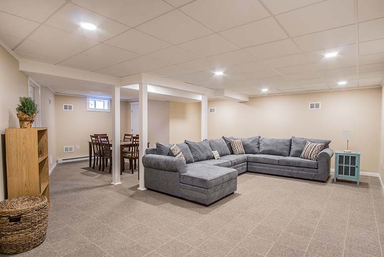 Living room with couch, dining table and tile