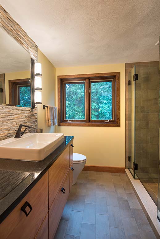 Bathroom remodel with mixed wood, stone, and granite materials